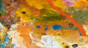 Färgglad färgpalett med orange, gula och blåa färger. Konstläger för ungdomar.